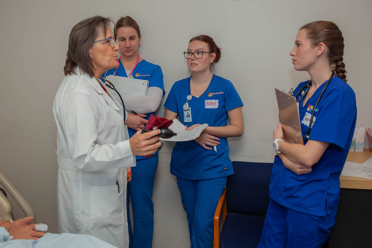 Medical team consultation in hospital patient room
